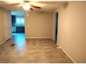 Open living room with tile floors flows into the modern kitchen with stainless appliances at 2822 Chetco River St, Laughlin, NV 89029