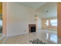 Living room featuring tile floors and a brick fireplace at 3127 Kennewick Dr, Las Vegas, NV 89121