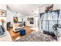 Bright living room with hardwood floors, neutral paint, and comfortable seating arrangement at 3673 Ian Thomas St # 201, Las Vegas, NV 89129