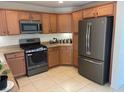 Modern kitchen featuring stainless steel appliances, granite countertops, and ample cabinet space at 3712 Garnet Heights Ave, North Las Vegas, NV 89081