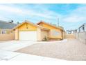Inviting single-story house featuring a well-maintained exterior and a two-car garage at 4616 E Idaho Ave, Las Vegas, NV 89104