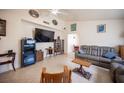Open-concept living room with neutral walls, tile flooring, and ample natural light at 4616 E Idaho Ave, Las Vegas, NV 89104