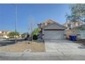 Charming two-story home with a spacious driveway and low maintenance landscaping at 4751 Lone Grove Dr, Las Vegas, NV 89139
