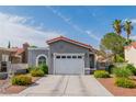 Well-maintained single-story home featuring desert landscaping, an attached garage, and a red tile roof at 6536 Pleasant Plains Way, Las Vegas, NV 89108