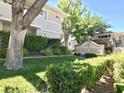 Welcoming Montereo community sign surrounded by lush greenery and mature trees at 668 Oakmont Ave # 1715, Las Vegas, NV 89109