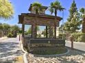 Elegant stone entrance to Las Vegas Country Club Estates with manicured landscaping at 668 Oakmont Ave # 1715, Las Vegas, NV 89109