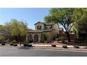 Charming two-story home with landscaped front yard and covered porch entry at 10804 Mason Hill Ave, Las Vegas, NV 89166