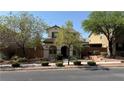 Charming two-story home with landscaped front yard and covered porch entry at 10804 Mason Hill Ave, Las Vegas, NV 89166