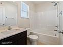 Bathroom features a shower and tub combination and a vanity at 1891 Via Del Prado St, Las Vegas, NV 89115