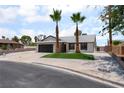 Charming single-story home with well-manicured landscaping and mature palm trees at 3086 Cardinal Dr, Las Vegas, NV 89121