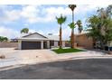 Charming single-story home with well-manicured landscaping and mature palm trees at 3086 Cardinal Dr, Las Vegas, NV 89121