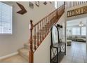 Inviting entryway with staircase, coat rack, and view into the adjacent living room at 5023 Salt River Ave, Las Vegas, NV 89139