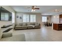 Spacious living room with tile floors, large windows, and modern decor at 5023 Salt River Ave, Las Vegas, NV 89139