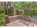 Inviting front entrance with stone accents, steps, and desert landscaping at 583 Saint Croix St, Henderson, NV 89012