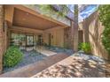 Stylish front entrance with stone accents, glass doors, and tasteful landscaping at 583 Saint Croix St, Henderson, NV 89012