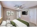 Comfortable bedroom offering ample natural light, ceiling fan, and easy access to an ensuite bathroom at 601 Cabrillo Cir # 536, Henderson, NV 89015