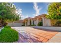 Spacious home with a three car garage and beautifully maintained landscaping enhances curb appeal at 8120 W Red Coach Ave, Las Vegas, NV 89129