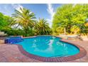 Inviting pool and patio area, perfect for relaxation and entertaining guests on sunny days at 8120 W Red Coach Ave, Las Vegas, NV 89129