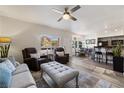 Open living area featuring a comfortable lounge, a dining area, and a partial view of the kitchen at 890 Kitty Hawk Dr # 2412, Mesquite, NV 89027