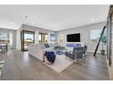 Spacious living room with modern fireplace, hardwood floors, and plenty of natural light at 112 Springbough Ln, Las Vegas, NV 89138