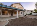 Home with covered patio, providing ample space for outdoor seating and entertaining at 1206 Evening Canyon Ave, Henderson, NV 89014
