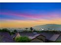 Stunning city view at sunset from a residential area with mountains in the distance at 1637 Wellington Springs Ave, Henderson, NV 89052