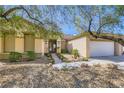 Inviting single-story home with desert landscaping and stone pathway leading to the front entrance at 1637 Wellington Springs Ave, Henderson, NV 89052