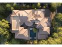 Expansive estate with lush landscaping, multiple wings, resort-style pool, and pristine roof at 17 Soaring Bird Ct, Las Vegas, NV 89135