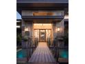 Unique front entrance with bridge over water feature and custom privacy screen at 17 Soaring Bird Ct, Las Vegas, NV 89135