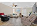 Cozy living room with neutral walls, tile floors, and ample seating, perfect for relaxing and entertaining at 2079 Port Royal Dr, Laughlin, NV 89029