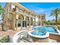 Beautiful backyard oasis with pool, spa, and outdoor grill, ideal for entertaining at 2200 Glenbrook Way, Las Vegas, NV 89117