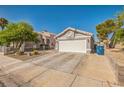 Charming single-story home featuring a two-car garage, low-maintenance landscaping, and a classic design at 2229 Bowstring Dr, Las Vegas, NV 89142