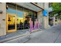 Inviting building entrance features a modern design with glass doors and prominent signage at 353 E Bonneville Ave # 449, Las Vegas, NV 89101