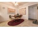 Dining area featuring a wooden table with four chairs and tiled flooring at 3550 Bay Sands Dr # 3089, Laughlin, NV 89029