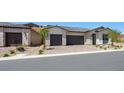 Beautiful exterior showcasing brick driveway and attached garages at 364 Tigullio Ave, Henderson, NV 89011