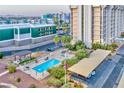 Inviting community pool area with lounge chairs and manicured landscaping at 3930 University Center Dr # 412, Las Vegas, NV 89119