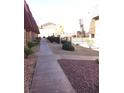 The exterior of the community features attractive landscaping, a fenced pool and sidewalks at 4421 Alexis Dr # 436, Las Vegas, NV 89103