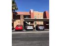Exterior shot of the apartments with covered parking, desert landscaping and convenient parking spaces at 4421 Alexis Dr # 436, Las Vegas, NV 89103