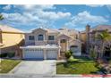 Charming two-story home features a three-car garage, a well manicured lawn, and a beautiful tiled roof at 4654 Stuttgart St, Las Vegas, NV 89147