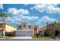 Charming two-story home features a three-car garage, a well manicured lawn, and a beautiful tiled roof at 4654 Stuttgart St, Las Vegas, NV 89147