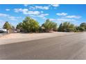 Single story home with desert landscaping and a long driveway on a sunny day at 4905 Ricky Rd, Las Vegas, NV 89130