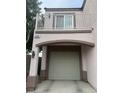 Attached garage featuring an attached balcony and covered parking at 508 Candy Mint Ave, Las Vegas, NV 89183