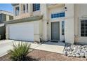 A well-maintained two-story home featuring a two-car garage and beautiful stone landscaping at 7813 Falconwing Ave, Las Vegas, NV 89131