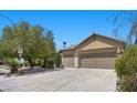 Spacious two-car garage with extended driveway at 9233 Onyx Point Ct, Henderson, NV 89074