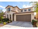 Well-maintained two-story home showcases a tidy lawn, neutral paint, and an attached two-car garage at , Las Vegas, NV 89166