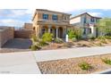 Charming two-story home featuring a covered front porch and desert landscaping, 'for sale' sign at 1102 E Dorrell Ln, North Las Vegas, NV 89086