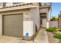 Close-up of the home's exterior, showcasing the front door and three-car garage at 1325 Baychester Dr, Henderson, NV 89002