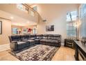 Spacious living room with high ceilings and a large, comfortable sectional sofa at 1325 Baychester Dr, Henderson, NV 89002