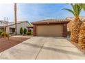 Inviting single-story home showcasing desert-friendly landscaping and a two-car garage at 3323 Bay Horse Ct, North Las Vegas, NV 89032