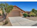 Charming single-story home featuring a two-car garage and desert landscaping at 3544 Tack St, Las Vegas, NV 89122